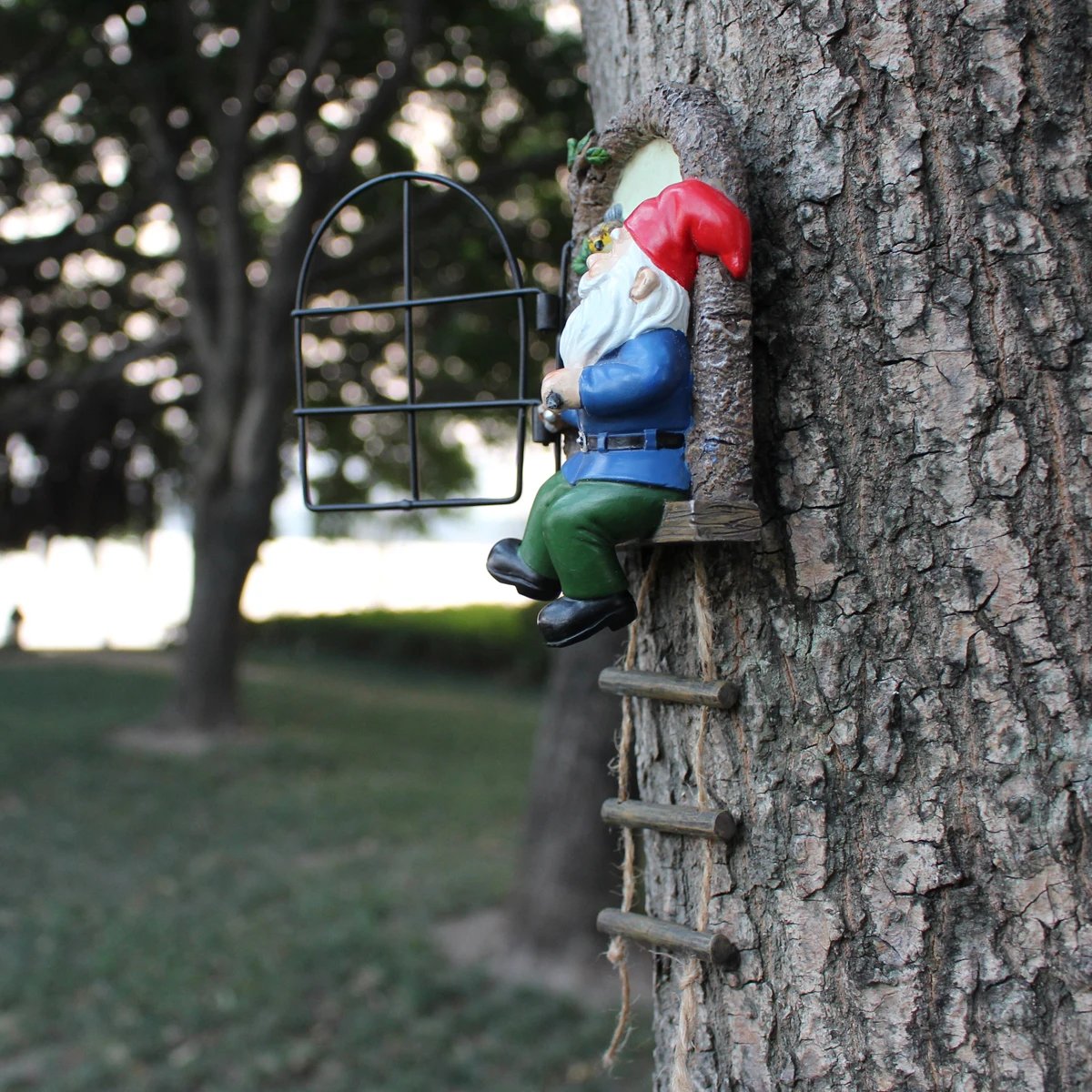 1 resin handicraft hanging from a dwarf playing piano tree, iron window, hanging tree, decorating courtyard tree trunks, hanging