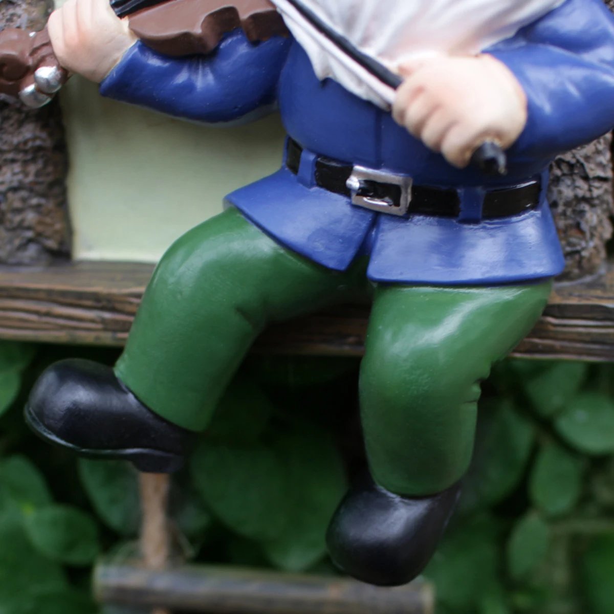 1 resin handicraft hanging from a dwarf playing piano tree, iron window, hanging tree, decorating courtyard tree trunks, hanging