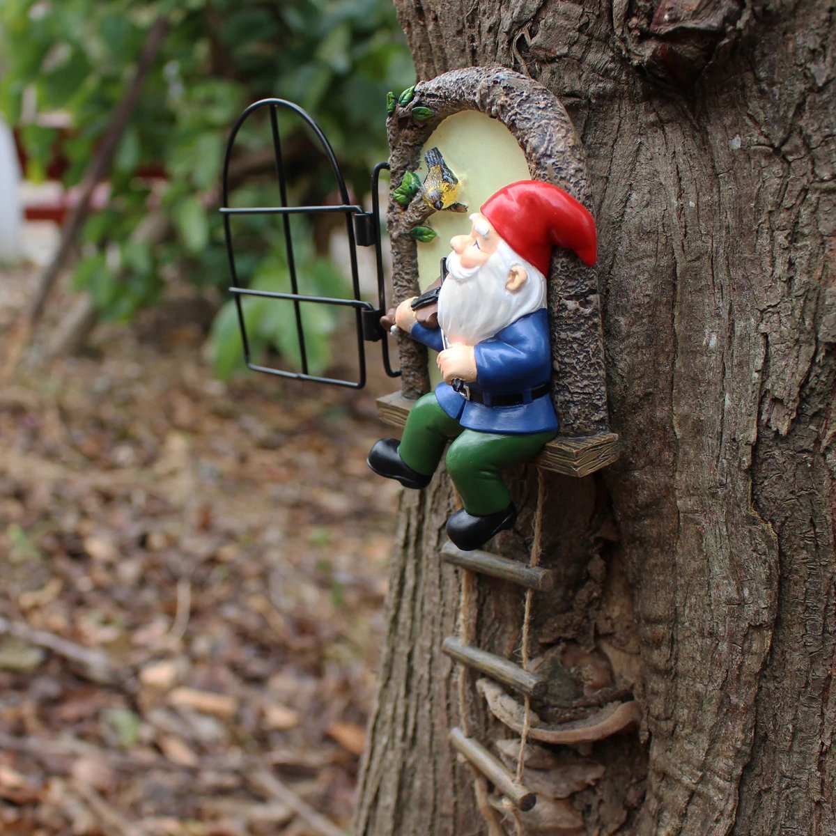 1 resin handicraft hanging from a dwarf playing piano tree, iron window, hanging tree, decorating courtyard tree trunks, hanging