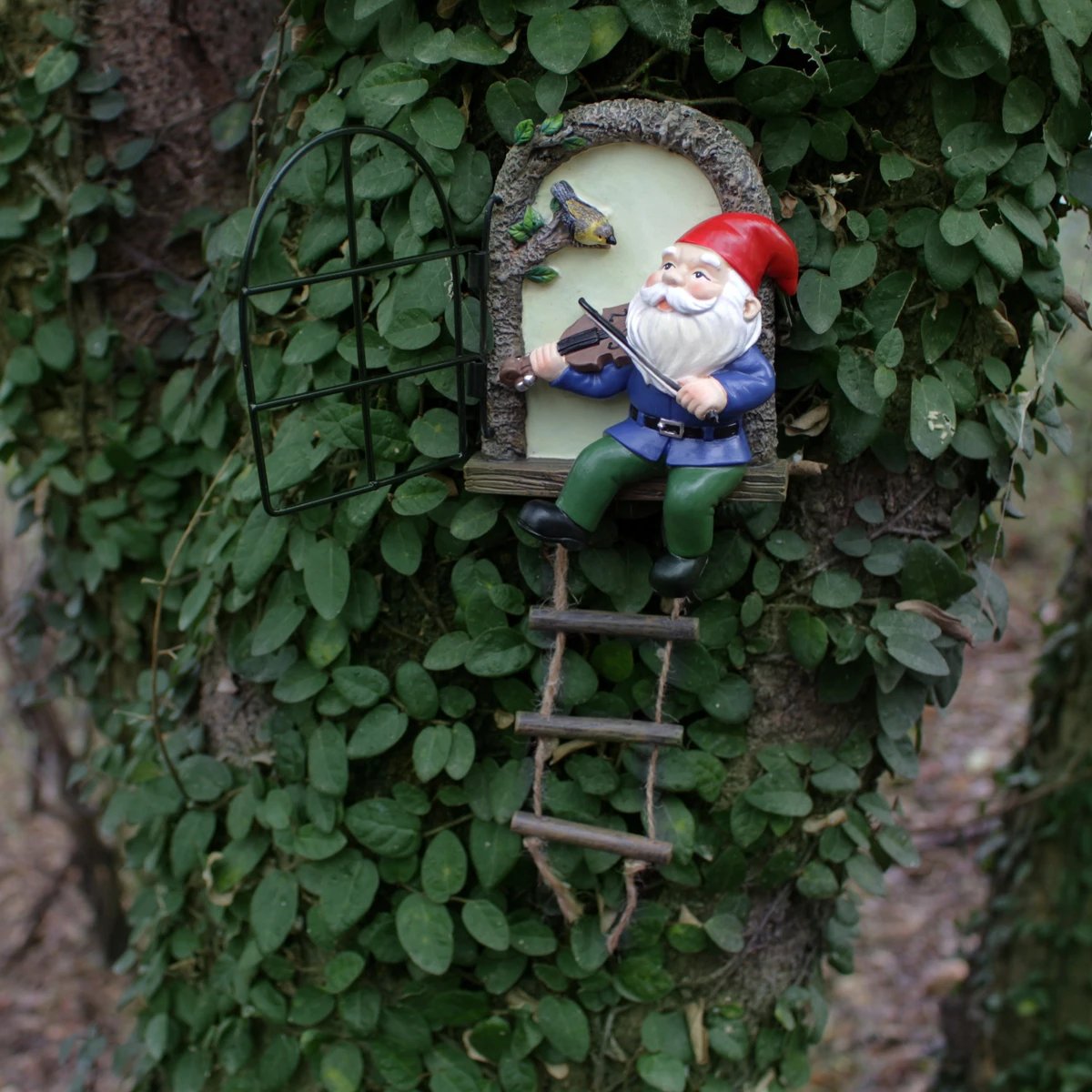 1 resin handicraft hanging from a dwarf playing piano tree, iron window, hanging tree, decorating courtyard tree trunks, hanging
